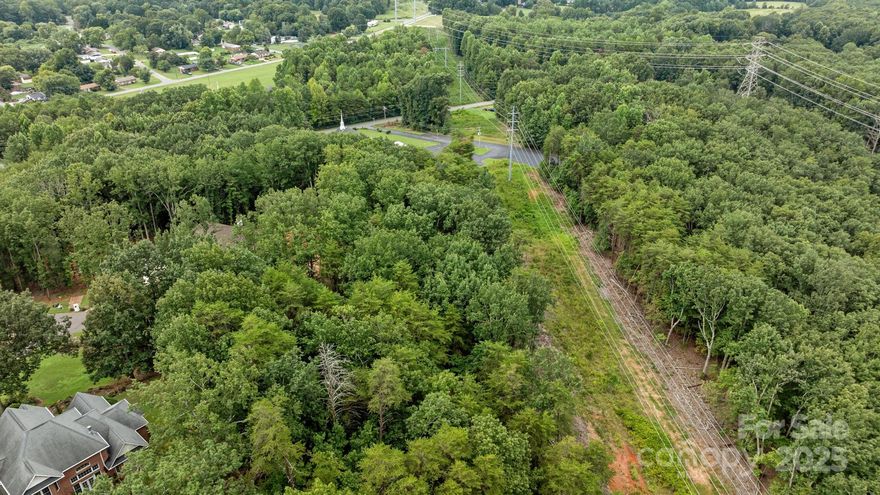 Build your custom home on this large double lot on Spanish Oaks Ln in popular "The Mountain" private subdivision in Gastonia NC. Property has an accepted septic permit on file for a four bedroom home and a plot survey.