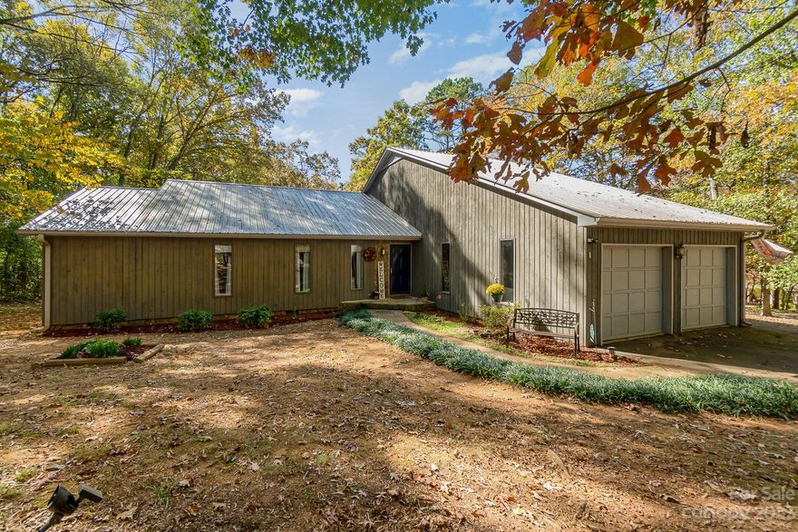 **$5000 seller credit given to buyer can be used to buy down rate or closing cost if under contract before 1/22! ** Home sweet home" best describes this country ranch tucked away on 1.8 acres in Midland! Move into the best of  privacy, space, and location! This charming custom built home provides high ceilings in the den providing lot natural light, a wood stove, open space with plenty of room all while enjoying beautiful country views. Large owners suite plus a total of 3 bed rooms, 2 bathrooms a 3 door garage equipped with a half bath. Gather friends and family in the kitchen equipped with a sitting room, breakfast nook w/ pretty bay windows. Custom brick veneer in kitchen boast of the character and charm throughout every part of this home. So many possibilities with 1.8 acres surrounding the home, large deck over looking private back yard. Make your dreams come true!