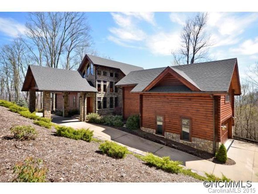 Rustic & very elegant log home located in the premier log home community of WNC. Spectacular entry w/portecochere, waterfall feature & grand oversized mahogany door. Home features 4BR/4BA, 2 half BA's, GR with mtn view, dream kitchen, numerous windows presenting Mtn Views and Lake Junaluska, luxury master suite, 1100 bottle wine cellar, elevator, FP's & extensive decks. Home located minutes from dining, golf & shopping!