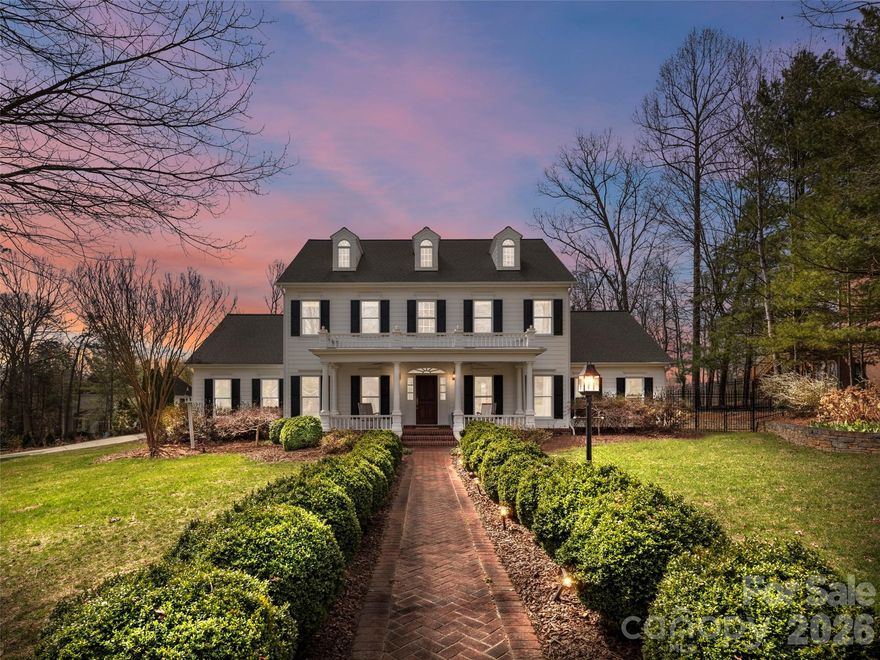 Charleston inspired elegance meets modern luxury in this beautifully updated home, ideally located in the coveted Holt enclave of Biltmore Park. Thoughtfully designed and meticulously maintained, this residence blends timeless Southern charm with high-end finishes and exceptional indoor-outdoor living. The completely renovated kitchen and dining area serve as the heart of the home, featuring Taj Mahal quartz countertops, custom cabinetry with designer hardware, premium appliances including a Wolf gas range, Bosch dishwasher, and wine refrigeration, all seamlessly opening to an inviting dining space with refined millwork and designer lighting. Multiple living areas offer warmth and character with fireplaces, custom built-ins, and abundant natural light, while the spacious main level primary suite provides a serene retreat with a soaking tub and walk-in closets. Outdoor living is truly exceptional, showcasing a covered patio with skylights, heaters, stone fireplace, and a tranquil water feature surrounded by lush landscaping and a fully fenced yard, perfect for entertaining or relaxing year-round. Additional highlights include smart home features and beautifully appointed guest suites. All just moments from Biltmore Park’s dining, shopping, and local schools, this home offers the perfect blend of convenience, comfort, and Southern sophistication.