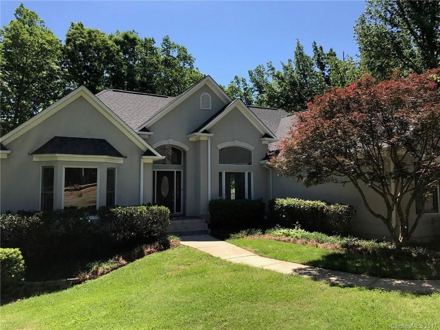 Stunning custom nestled on 1+ ac wooded lot. Enjoy the extensive updates to this open home. Dramatic vaulted 2 story great room with windows galore & dramatic fireplace. Chef's kitchen w/ designer granite, backsplash, GE Profile dble ovens, new SS dishwasher, micro & cooktop. New carpet, paint, lights. Luxurious Master on main. 3rd garage bay w/ work area off ENORMOUS partially finished walk out basement w 1200 sqft new carpet . New high-end energy efficient dual fuel HVAC. Newer roof.