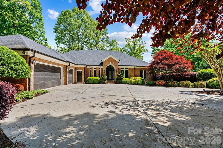 Welcome to luxury lake living in the highly sought-after Heron Harbor Subdivision on Lake Norman. This exceptional estate at 22026 Satilla Drive offers an impressive 7490 square feet of living space on a generous 0.69-acre lot, perfectly designed for comfort, entertaining, and waterfront enjoyment. This expansive 1-story with basement full brick home features room for the entire extended family for all the family gatherings with 7 bedrooms, 5 full bathrooms, and 1 half bath.  After purchasing the home in 2020 and shortly after confronted with the pandemic these sellers went to work completely renovating this home literally from top to bottom.  Inside features all new hardwood floors encompassing the entire main level, modern fixtures and paint, full luxury spa like bathroom renovations, kitchen reno with updated appliances and quartzite counter tops, and all new doors and windows.  That's just the main floor.  The basement inlaw suite (the most luxurious I have seen brought to market) was completely reimagined  It features an elevator to provide easy access to the main floor, 2 full bedrooms, custom kitchen that rivals the main kitchen in most homes, full bath with no step shower entry, laundry, multiple storage closets and pantry, large living and dining area as well as beautiful lake views and easy walk out.  

In addition to the many interior updates made throughout the home the owners also took care of all the big ticket items you don't think about as well including a 2020 roof, two new water heaters, new gutters with gutter guards (installed approximately 2 years ago), one HVAC unit replaced 4 years ago, new Grinder Pump from basement to sewer 3 years ago,windows, and garage door openers.

Designed for today’s connected lifestyle and with so much sq footage to be covered, the home is equipped with a whole-house mesh WIFI system and a security system with cameras that convey along with a bolted in safe.

Car enthusiasts and hobbyists will appreciate the 4 garage spaces, with a 3-car garage on the main level and an additional lower-level garage that is best used as the lake toy storage or a shop. 

Step outside to enjoy the large back deck or patio from basement both of which are completely shaded in the afternoon.  You will immediately notice the lush landscaping of this property including a full-yard irrigation system and a dedicated garden bed irrigation system.  Both of which have this property looking absolutely stunning in full spring bloom at the moment. Prior to heading down to the lake take a moment to take in the privacy and surroundings from the fire pit and gold fish pond with fountain.  Once you take the very easy stroll to the lake you will encounter true lakefront living with a floating private dock, perfect for swimming, boating, fishing, and relaxing on Lake Norman. The beautifully maintained grounds , and a serene fish pond with a new pump and goldfish. The back deck offers comfortable afternoon shade beginning around 3:30 PM—ideal for outdoor gatherings.

Conveniently located near Interstate 77, this home provides easy access to Birkdale Village for premier shopping, dining, and entertainment, and is just 30 minutes from Charlotte.

This rare Lake Norman property combines luxury, space, and prime location—an extraordinary opportunity to own a premier waterfront home.