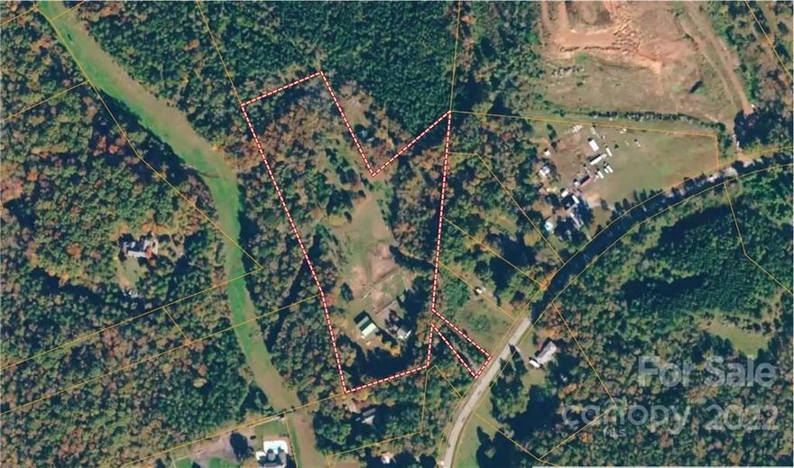 This 10.5+/- acres is located in the rapidly growing SW Charlotte area.  This property has development potential and adjoins to an approved townhome project by Meritage Homes. It also could be used as a private estate/horse farm. The property to the North of this property has a 15 ft easement to access. Call the listing agent for more details regarding the property.