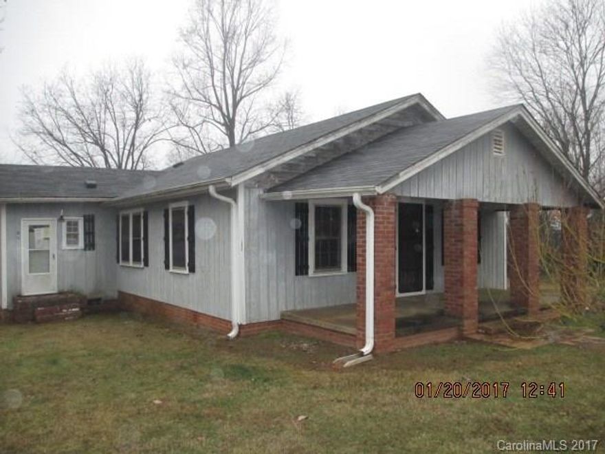 Home sits on 1.80 acre lot.  Needs improvements and tlc. Lot of home for the money! Sold As Is!