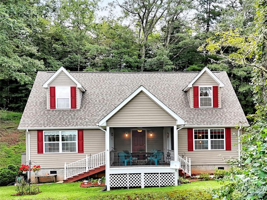 This meticulously maintained home is situated in a serene setting with breathtaking mountain views, & offers the perfect blend of comfort & privacy. Relax on the screened porch while overlooking the views, & savor the wonderful sounds of birds & nature, as you enjoy the beautiful gardens. Featuring sparkling hardwood floors, a spacious kitchen & dining area, walk-in laundry & pantry, 3 bedrooms plus a 4th bedroom or office & 2 full baths, with the primary bedroom on the main level. Two generously sized guest bedrooms on upper level, which is perfect for family & friends to enjoy their own retreat! This property is ideal for both full-time living or a mountain getaway. Located at the end of the road for privacy, all in a wonderful subdivision with easy year-round access.  New Roof 2024. Short term rentals are allowed.