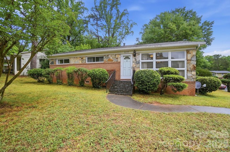 This charming brick home offers timeless character with thoughtful updates and a layout designed for comfortable everyday living. Step inside to an inviting living space with beautiful hardwood floors, and a wall of windows overlooking the front yard. The open flow between the living and dining areas creates the perfect setting for both relaxing and entertaining.The kitchen features ample cabinetry, functional layout, and a convenient pass-through to the dining area—ideal for staying connected while hosting. All new kitchen appliances. Step outside to enjoy the expansive backyard complete with a large stone patio—perfect for outdoor dining, entertaining, or simply unwinding. The fenced yard offers privacy and room to garden, play, or add your personal touches, while a detached storage building provides additional convenience. This home is only minutes away from shopping, dining and commuter routes.