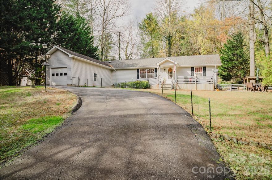 UPDATE: In addition to the peace of mind provided by a whole home generator, Seller is also offering a ‘Supreme’ level 2-10 Home Buyers Warranty for 1 year from closing date!

Offering Seamless Indoor-Outdoor Living in a Private, Leafy Setting.

Welcome to this beautifully maintained single-level home, tucked away on a peaceful, tree- lined private road in desirable Zirconia. Set on a spacious lot with easy access to Highway 25 and I-26, this home offers both tranquility and convenience— minutes to Hendersonville, 30 minutes to Arden and less than 40 mins to Greenville SC!

Open-Plan Living with Natural Flow

Step inside to discover over 1,700 square feet of thoughtfully designed space where the kitchen, dining, and living areas connect effortlessly. The open-plan layout creates a sense of spaciousness and ease, ideal for both everyday living and entertaining. Rich 3/4-inch oak hardwood floors run throughout the main living areas, adding warmth and continuity.

The heart of the home is the expansive solid wood chef’s kitchen, featuring granite countertops, soft-close cabinetry, modern appliances, and a large central island with abundant storage. Whether you're preparing meals or hosting, the kitchen flows seamlessly into the dining area and living room, keeping everyone connected.

Comfortable Bedrooms & Versatile Spaces.
 
The generously sized master bedroom is privately situated at the rear of the home with an ensuite including a double vanity with vessel sinks, granite counters, a soaking tub and shower. Two additional bedrooms offer flexible spaces that would also be ideal for crafting / hobby / office space if preferred.

Exceptional Outdoor Living.

Step outside to an impressive 800+ square foot rear deck that spans the length of the home, complete with a gazebo for shaded relaxation or entertaining. Whether you're grilling, relaxing with a book, or simply enjoying the surroundings, the fully fenced deck offers peace of mind and a serene natural backdrop.

To the front enjoy a rocking chair ready porch, ideal for morning coffee whilst watching the wildlife or checking on your pumpkin patch. There is also ample space for outside dining, lounging or a fire pit.

Practical Features:

• Whole home generator
• No HOA fees
• Circular driveway
• Front ramp for added accessibility
• Large attached single garage (390+ sq ft)
• Storage shed, perfect for tools or gardening supplies

Lovingly cared for, this home offers a brilliant blend of open-concept living, functional design, and outdoor enjoyment in a quiet, natural setting. Book a showing today!