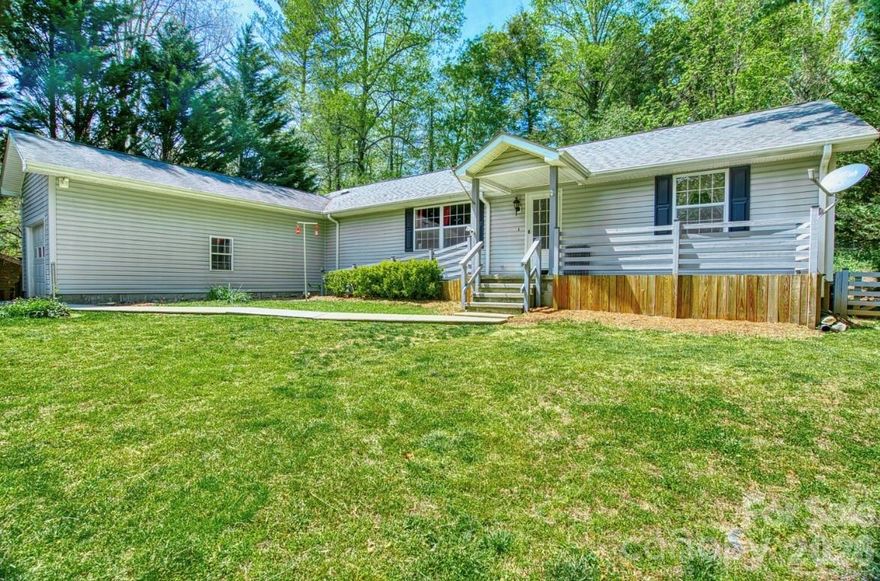 Private & Peaceful & Move-In Ready. 
Major Price Improvement!

Tucked away on a quiet, tree-lined road in Zirconia—just minutes to Hendersonville and within easy access to Greenville, SC.

The Highlights:

* 1,700+ sq ft single-level living
* Bright, open-concept layout
* Beautiful oak hardwood floors
* Chef’s kitchen with granite countertops
* Large island for gathering + prep
* Soft-close cabinetry throughout

Smart Layout:

* Split-bedroom floor plan for privacy
* Spacious primary suite
* Soaking tub + double vanity
* Two additional flexible bedrooms (guests, office, hobbies)

Outdoor Living:

* Expansive 800+ sq ft deck
* Covered gazebo
* Ideal for entertaining, grilling, or unwinding

Bonus Features:

* Whole-home generator
* No HOA
* Circular driveway
* Extra-height attached garage (perfect for larger vehicles or workshop use)
* Storage shed
* Front ramp access

Don’t miss this gem. Tucked into a beautifully private setting, this easy living gem won’t last long. Schedule your showing now!