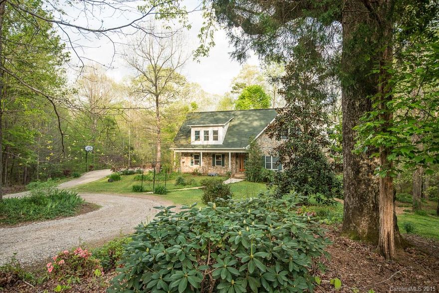 This home feels like a mountain vacation! Full stone exterior, 5 bd, 4.5 bath delight nestled among hardwoods & overlooking its own private pond. Special details include paneled & beamed cathedral ceiling, NC slate stone fireplace, Hickory flooring.  A full wall of windows on the back of this gem to enjoy the peek of sunrise & all mother nature has to offer.  Retreat to the screened porch for morning breakfast or the basement rec room for fun & games w/ friends. Home warranty included!