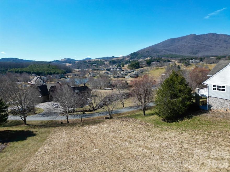 Enjoy incredible mountain and community views from this premier homesite located in Jefferson Landing! This lot runs from road to road and would be great for a floor plan design with a walkout lower level. Jefferson Landing, a gated golf community, features a magnificent 18 hole golf course. Additional amenities associated with Club Membership include access to the clubhouse, swimming pool with dining/ bar area offering tasty food & drink options, well equipped fitness center, pickleball /tennis courts and Riverside Park, which features a covered pavilion adjoining the New River. Himalayan style putting course & a total of seven par 3 practice holes w/ bar & food options available. There is a $1000 Capital Improvement fee pd to the JL POA, by the buyer at closing.