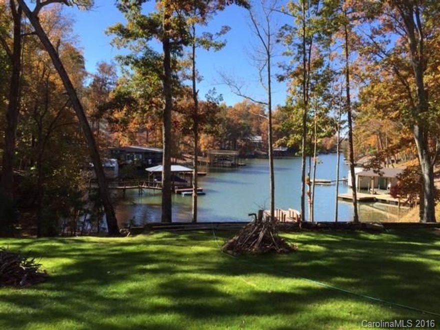 Here's your chance to build your dream home with fantastic unimpeded waterviews! A short golf cart ride to Palisades Country Club. Beautiful waterfront lot on Lake Wylie. Fabulous sunsets and sandy beach . Great views out to main channel. Mature trees on property. Great location, minutes to Rivergate shopping and restaurants. Dock already in place. All that is missing is your boat and your dream home.