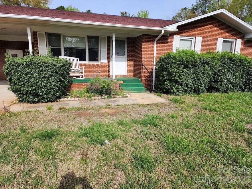 3 ACRES with Brick Ranch House, Carport & outbuilding.  3 Bedrooms, Ceramic bath & additional half bath.
Large family room opens up to dining area off the kitchen.  Glass sun room off the back.  Beautiful
Windows are double pane insulated. Roof is good!  Beautiful yard with mature trees!