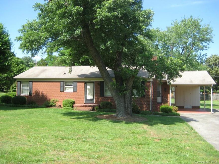 Very well kept home with hardwood floors, full brick in a convenient location.Close to hospital, park, grocery, interstates. Easy livable floor plan with open kitchen, breakfast area and den.Living room is spacious and has a brick fireplace,glass doors electric logs.Brick building in back of house  has kitchen sink and electric cook top and fireplace.  Possible second living with bathroom,HVAC added.Very well built home with bright living environment at good price in good location.Home Warranty