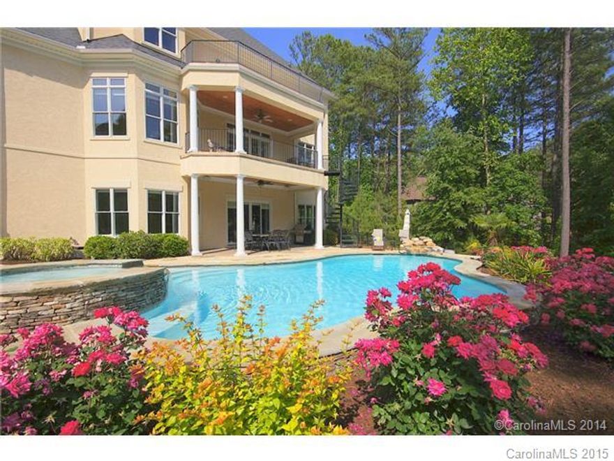 Lake Norman Living @ its best in this waterfront home @ The Point or Trump National Charlotte! Great home for entertaining w 5 bdrms (septic for 4) & 2nd living quarters! Situated on a deep cove, you will enjoy hours of fun & relaxation from the private dock/jet ski lifts & custom pool/hot tub! 2 covered porches w views of LKN! Media Rm adds to the fun in this home! Neutral interior, Brazilian cherry hardwoods & more! Low taxes, Iredell schools & 40 minutes from Charlotte! Great club amenities