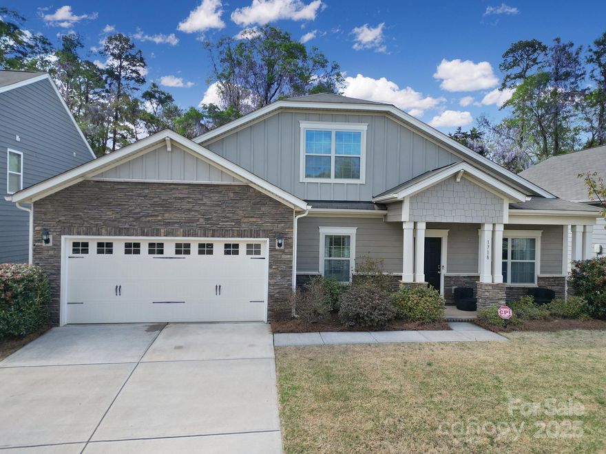 Prime Location!!! Beautiful 5 BR, 3 BA home with a loft in Fort Mill, SC. This open concept home offers generous living space on the main level, including primary suite, two add'l guest bedrooms with access to a full bath, formal l/r & office space, family room & gourmet kitchen. Wood flooring extends from entry thru kitchen & family room. Enjoy entertaining at your oversized island in kitchen area featuring skyline cabinets, granite countertops, tile backsplash, SS appliances, pantry, can lights & pendant lighting. Coffee bar! Family room w/stone gas log fireplace. Primary Suite sits at the back of the home overlooking private backyard with ensuite bath, dual sinks, walk-in shower & generous walk-in closet. Laundry is on the main floor w/shelves & folding table. Upstairs offers two add'l bedrooms plus loft. Enjoy sitting on your front porch or back patio. Don't forget to check out the walk-in attic space! This home is Energy Star Certified with a transferable warranty.