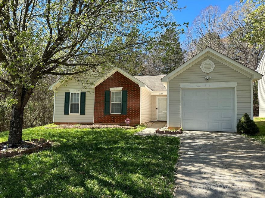 This cheerful one story ranch home features vaulted ceilings in the living room, kitchen/dining and primary bedroom, a gas log fireplace, plus tile & laminate floors throughout!  Outside, the home sits on a fantastic lot with great privacy as it nestled in the woods both behind and on one side of the property.  This great natural buffer provides the privacy most seek while relaxing on the patio in the beautiful Charlotte weather.  This home is also located just a short distance to several highways and interstates making for quick access to shopping, restaurants, Charlotte Douglass International Airport, Mountain Island Lake, the White Water Center, and of course also for commuting to Charlotte's Center City for work.  Don't miss your chance at this lovely home!  Household Gross Income must be at least 3x Monthly Rent.  Good Credit Only (600+).  Pets accepted conditionally with owner approval and one-time non-refundable pet fee.