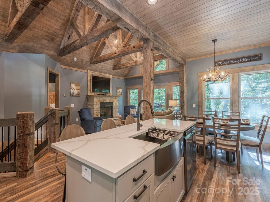 Welcome to the luxurious Blessed Falls Lodge! This custom built 3 bed, 3.5 bath cabin sits on 1.46 acres with approximately 400 ft of creek frontage. Throughout the cabin are stunning 200 year old hand hewn beams mixed in with modern touches such as tile in the Master Bathroom and quartz countertops in the kitchen. Each room offers a gorgeous view of the creek that you can walk down to and fly fish in. The inviting firepit sits just a few feet from the creek steps leading down to it. All the beautiful furniture is included. This cabin is a Superhost on Air-B&B with 5 star ratings over the last 2 years.  Imagine sitting on the back deck or in the hammock enjoying the sound of the creek and occasionally seeing elk, turkey, and deer. This home is on a flat road with no HOA, 5 minutes from Maggie Valleys shops, 10 minutes to the Cataloochee Ski slopes & Ranch, 15 minutes to Waynesville, NC and 45 minutes to Asheville. It also has plenty of parking for you and your guests.