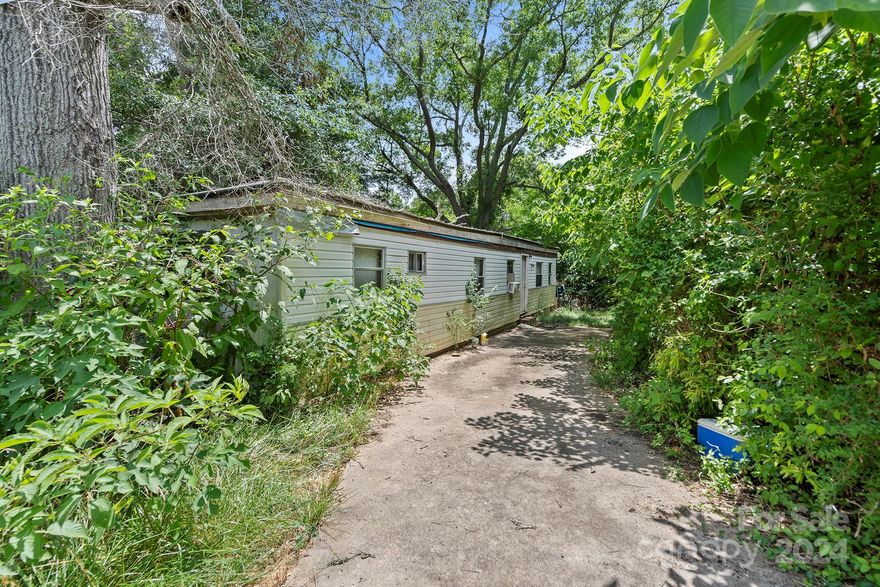 This unit is unliveable and was listed at a price where that was taken into account - land value only.  Enter at your own risk.  Unit is sold as is, where is.  Cash only.  All known information is listed.  Email and Text with questions - no calls.  The mobile home has been affixed to the land, per owner and is real property.