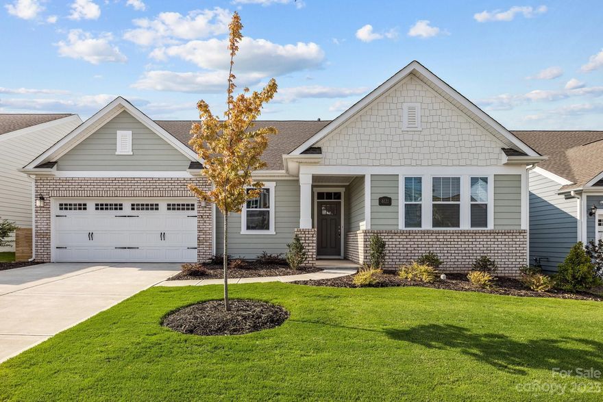 Prime location in Ansley Park backing to natural area! This beautiful ranch with 2nd floor bed/bonus room has been lightly lived in and feels brand new. Light, bright and airy throughout with fantastic backyard views as soon as you step in the front door. The open floor plan is perfect for entertaining and the gorgeous kitchen has all the space you need with a large island, gas cooktop, wall oven/microwave, and soft close drawers. Primary and secondary bedrooms are split for privacy and the upstairs bonus room is a great retreat. You will also enjoy a flex space on the main floor perfect for home office, hobby room, or additional dining. The spacious primary suite offers backyard views and an en-suite bath with dual sinks, walk-in shower, and 2 oversized walk-in closets. Many extras include a large 2.5 car garage, built-in drop zone, huge attic for storage(418 sq ft!), EV charging outlet, fully fenced backyard and covered porch to enjoy the view. Neighborhood pool is a nice bonus!