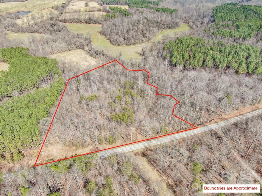 This pristine 6.62-acre tract in Northern Iredell County sits on the edge of the Brushy Mountains and offers the feeling of high-elevation seclusion while remaining incredibly convenient to major highways and metro areas.
The property features approximately 480 feet of road frontage, mature hardwoods, natural topography, and peaceful creek access. With multiple potential homesites, you can choose a private, tucked-away build or take advantage of the gentle terrain for a more accessible homesite. A recent survey is on file for added confidence and clarity.
There are no known restrictions and no HOA, offering flexibility for a primary residence, mountain retreat, recreational use, or potential development (subject to county approval). Property is in a farmland preservation district.  The surrounding rural character is thoughtfully maintained, helping protect the open, scenic setting.
Enjoy privacy and the beauty of mountain surroundings while staying just:
 • 10 minutes to I-77
 • Approximately 45 minutes to Boone
 • Around 50 minutes to Charlotte
 • About 40 minutes to Winston-Salem.
Properties offering acreage, water features, road frontage, privacy, and proximity to major cities are increasingly difficult to find. Whether you’re looking to build now or invest for the future, this tract offers a rare combination of natural beauty, flexibility, and location.
Buyer to verify utilities, septic, well, zoning, and intended use.