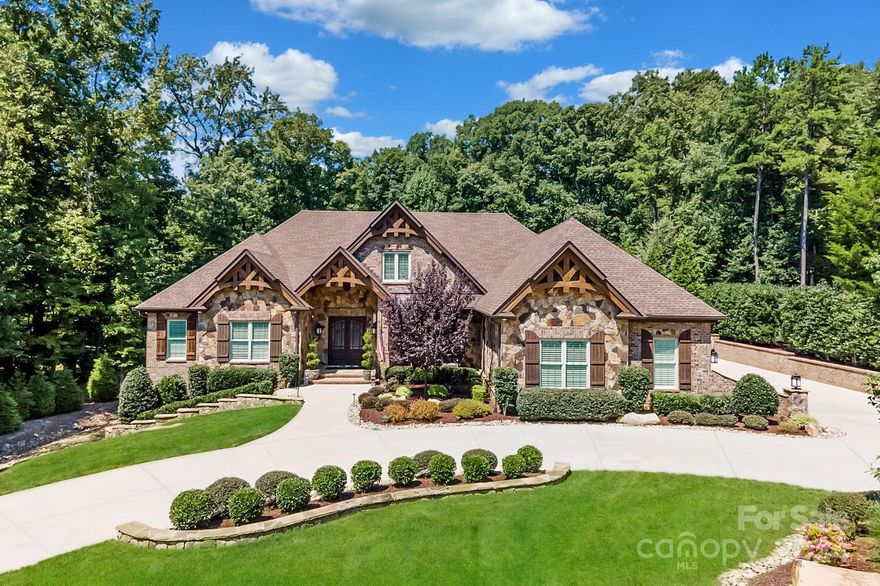 Masterpiece! - Exquisite custom home in prestigious Eppington South. This stately home boasts the best in quality and craftsmanship. Spacious open floor plan, perfect for entertaining. Truly spectacular 2-story Great Room with exposed arched beams and cozy natural stone fireplace that opens to a breathtaking enclosed Sunroom with natural stone fireplace. Ultimate Chef’s Kitchen with Wolf 30” double convection ovens, Wolf 48” gas stovetop, Wolf microwave, Subzero 48” fridge/freezer and Subzero 68” wine fridge. Elegant Owner’s Suite on Main Level opens to luxurious Bath with radiant heated floors and spacious custom closet. Fully-automated music system throughout Main Level. Stunning walnut flooring throughout. Whole house water filtration, dehumidifier system, fully automated- Wifi accessible- lawn irrigation, new roof 2019. Oversized three car dream garage with finished floors, slatted walls, and custom storage. Meticulously maintained, no detail was spared in this elegant home.