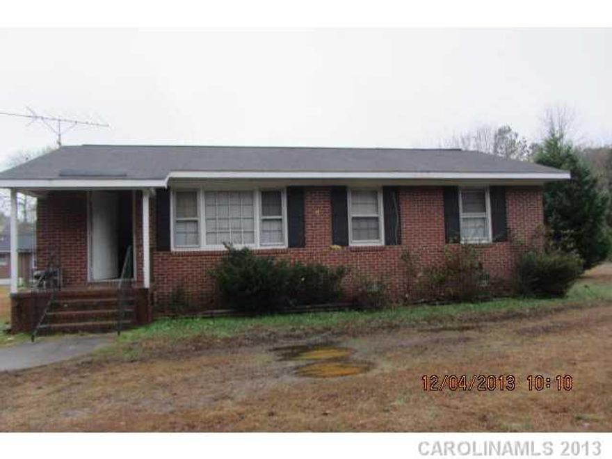 3/1 brick ranch. Large eat in kitchen with white cabinets. 2 large bedrooms. Large corner lot on a dead end street. age is estimated. Needs paint and carpet. Solid house. Sold 'as is'.