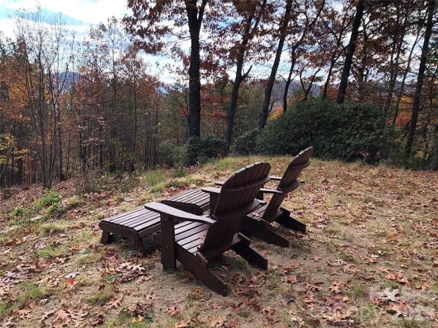 Have you been waiting for a really nice long range view lot? Here it is and it already has a driveway and building pad roughed in - PLUS a recently approved 4 bedroom septic and well permit! Build your dream mountain home, 2nd home or rental investment home close to Black Mountain, Lake Lure, Asheville and the Blue Ridge Parkway. This community of nature lovers has a small lake for swimming, fishing and water sports. We also have a gorgeous waterfall with a picnic area and a hiking trail along Sally Branch from the waterfall to Lake George. The Hillman Brewery and Whaley Farm Brewing in downtown Old Fort is perfect for a quick evening out. Old Fort is the affordable solution to own your mountain log cabin near Asheville, NC. Includes 2 lots - 545 also!