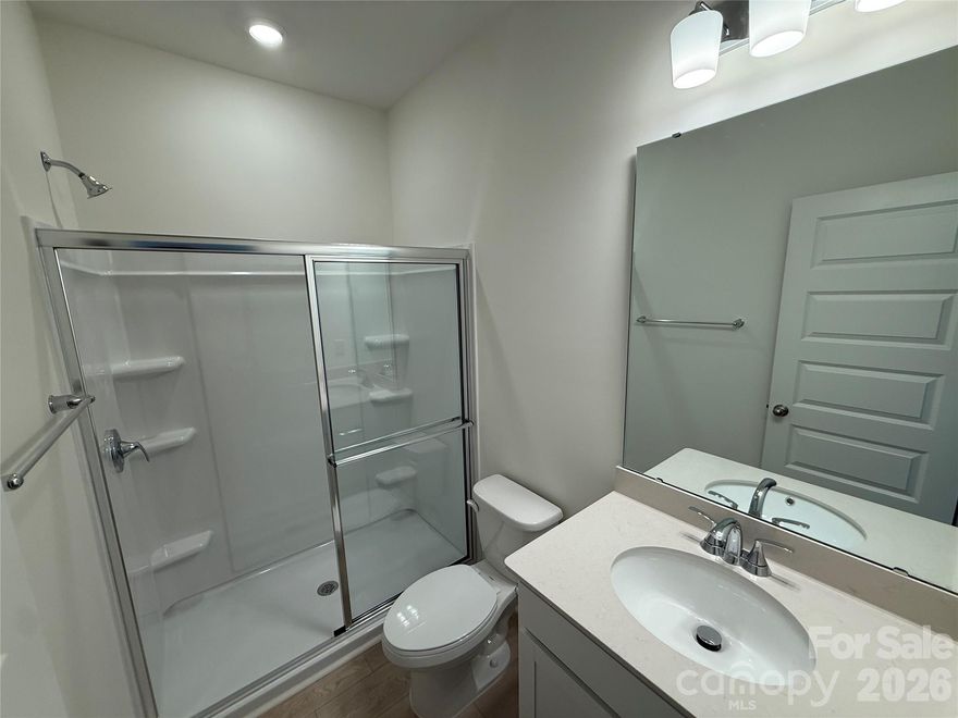 Available Now - and make your move even easier with the fridge, washer, dryer and blinds already going in!  Amenities include pool, cabana, playground and soccer field! Location is just down the street to 74 Bypass. This home is one of the top selling floorplans in the community and is decorated as a Model Home. Enjoy a rocking chair on your front porch! The first floor includes a bedroom and full bathroom, wide open living space for flexible living and entertaining, tons of kitchen cabinets, and STORAGE space under the stairs. On the second level you will find a second entertaining space, two bedrooms down the hall with a shared bathroom, laundry room and primary retreat. This primary is designed for relaxation! Walk in closet, Deluxe primary bathroom with a walk-in tile shower, double vanity, private water closet and linen closet. This home was designed by our Professional Design Team. This home will be ready for you early 2026, please visit the Model Home for a tour and more information!