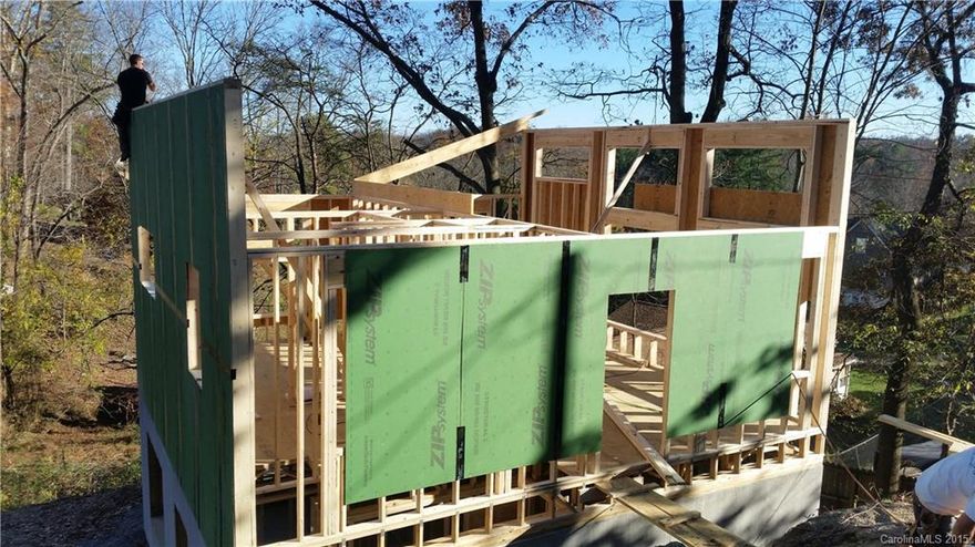 Modern design. Picture is of Similar home done on another lot. Wide plank wood floors Vaulted ceilings, tile surrounds and floors in bath, stained concrete floors, granite in kitchen, soft close doors and draws for cabinets, large windows with large back deck. Realtor is builder and owner is family to Realtor.