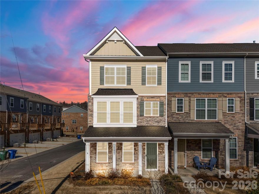 Welcome to 11043 Lawyers Rd – a beautifully designed 3-level, 4-bedroom, 3.5 bathroom END-UNIT townhome with a 2-car garage and an open floor plan with abundant natural light! A first-floor bedroom with a full bath offers flexibility for guests or a home office.

The spacious main level features a gourmet kitchen, stainless steel appliances, and a large island—perfect for entertaining. Enjoy your morning coffee or unwind in the evening on your private balcony. Also featured is the dining area which flows seamlessly into the living room with an electric fireplace.

Located on the third level is the luxurious primary suite; a true retreat with tray ceilings and nice walk-in closet. Two other nice sized bedrooms complete the third level.

Conveniently located near shopping, dining, and major highways. Don't miss this incredible opportunity to own a gorgeous townhouse right in the heart of Charlotte!—schedule your tour today!