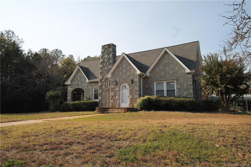 Imagine yourself in this charming, stone home on almost 3 acres! Home is freshly painted with beautiful, original hardwoods throughout. Enjoy a cozy winter in this unique home with large rooms, 10 ft ceilings, a wood burning fireplace and large dining room with butler's pantry perfect for entertaining. Oh how you'll love the french doors leading to the side porch that will make for a fun breakfast date. Kitchen includes large walk-in pantry and custom cabinets. Close to Rock Hill Country Club.