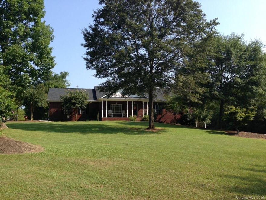 This stunning Custom built 5BR 3 BA home on 6 beautiful acres of land. This home offers a fully finished walk out basement which is a complete 2nd living quarters. A screened in porch over looking a 18 X 37 foot  in  ground pool with pool house. Attached 2 car side load garage. Also detached work shop with 2 over head doors. 2 covered rocking chair porches. Exceptional craftsmanship and beautifully decorated.