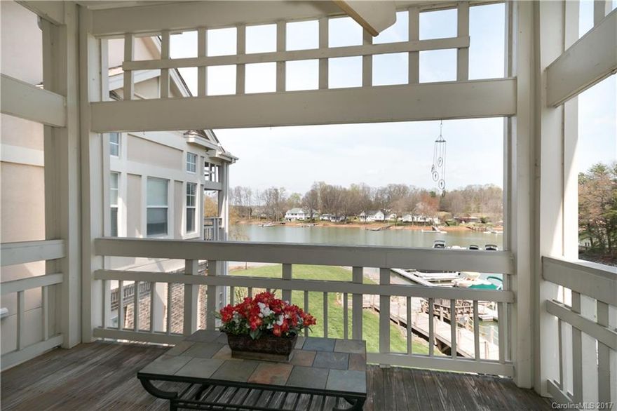 Penthouse condo with awesome Lake Norman views, just in time for warm weather!  High ceilings & transom windows surround the open floorplan & Master lending a light & airy feel to neutral interior.  Granite sparkles in a crisp white kitchen w/eat-in bar.  GR w/updated fan, wet bar & gas FP leads onto newly stained deck, also accessed from Master.  Master BA has fresh color palette w/new tile floor & shower. All BRs w/Walk-in closets! Comm Pool, Tennis & boardwalk along the shoreline.