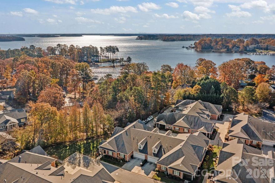 Welcome home to effortless living in 3 Cherry Way! Step into this beautifully designed home where comfort meets sophistication. From the moment you walk through the door, the open floor plan and soaring ceilings create a sense of space and ease, perfect for gathering with friends or simply enjoying quiet mornings at home. The spacious living room flows seamlessly into the dining area, accented by a tray ceiling that adds a touch of elegance. Double French doors off of the dining area open to a screened porch where you can take in the peaceful view of the tree line from this perimeter lot. The kitchen is both stunning and functional, featuring rich wood cabinetry, gleaming granite countertops, stainless steel appliances, tile backsplash, and thoughtful details like under and over cabinet lighting. A convenient breakfast bar invites conversation while you cook, and the large pantry ensures everything has its place. Just off the living room, the bright sunroom offers endless possibilities such as a cozy reading nook, home office, or peaceful workout space surrounded by natural light. The primary suite is a true retreat, showcasing a triple tray ceiling, spa-like ensuite with a curbless oversized shower, dual vanities with extended counter space, and generous storage including a walk-in closet and linen closet. On the opposite side of the main level, you’ll find a second bedroom filled with natural light and a walk-in closet, along with a nearby full bath for guests. Upstairs, is a versatile third bedroom or bonus space with a walk-in closet, half bath, and easy access to expansive walk-in attic storage that is ideal for hobbies or seasonal décor. Life here is about connection and convenience. The community offers a welcoming clubhouse, pickleball court, an outdoor pool, and a covered picnic area. Whether you prefer peaceful mornings on your porch or joining neighbors for an activity, you’ll find the perfect balance of relaxation and engagement without the high HOA fees found in many other 55+ communities. Located just minutes from Lake Norman, dining options and everyday conveniences, this home offers the best of low-maintenance living in a vibrant 55+ community. Come experience the lifestyle you’ve been waiting for where every detail feels just right.