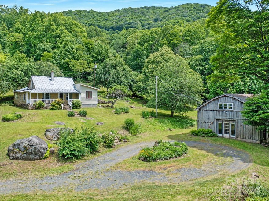 SELLER CALLING FOR HIGHEST AND BEST BY 5PM WEDNESDAY, 6/19/24.
The former home of Pine Root Pottery, this property has so much to offer. Located at the end of Pine Root
Branch Road, privacy and high elevation is premium. Pine Root Branch rushes down the mountain providing
water falls, soothing sounds and a picturesque landscape for your mountain homestead. The old farmhouse
and barn are ready for your vision. Lots of the building materials needed to make this your own are there
for immediate improvements. Established fruit trees and terraced garden areas are already in place on the
cleared acreage. The barn is perfect for a workshop or pottery studio and has unfinished living space on
the 2nd floor. The house has been a work in progress and is ready for someone to finish a dream not
realized.