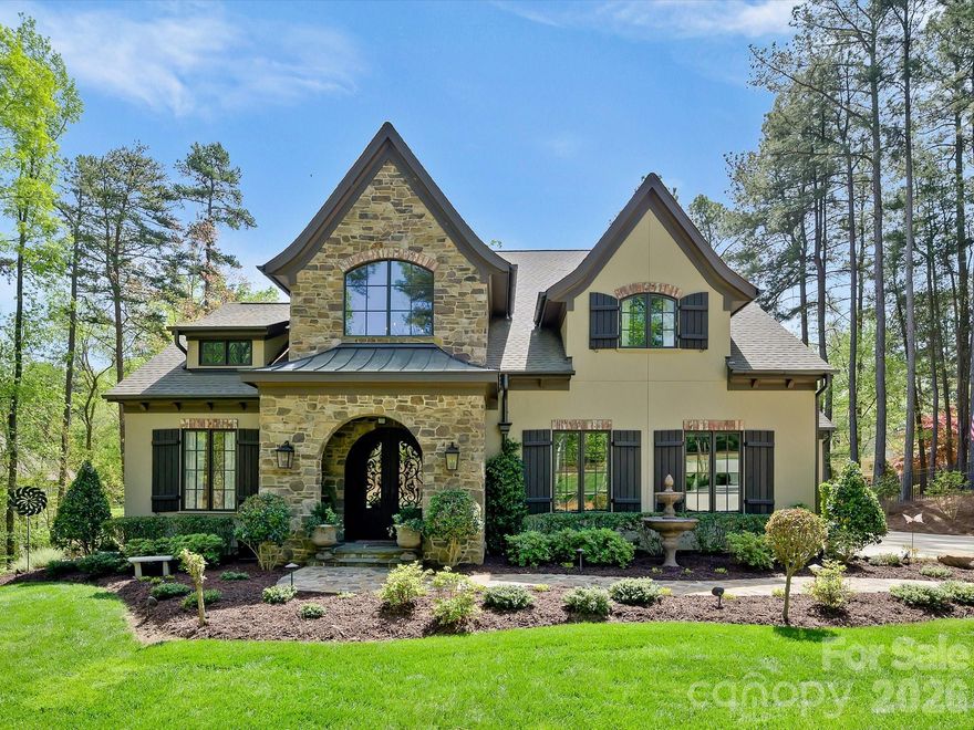 This home has is it all! With the most beautiful setting it is truly one of a kind on The Point. Real stone on exterior and inside fireplace. Includes master on main floor w/ luxurious master bath, walk-in glass shower w/ custom travertine & seat, and double vanities, dining room, study & several French doors, beautiful kitchen, 3 car garage, & main floor deck with lake views.Gourmet kitchen includes, 6 burner stove, built-in dishwasher, wall microwave,  fridge, large marble island & walk in pantry. Marble and travertine throughout. Upper level w/ bedrooms, bathrooms, media room w/built-ins. Balcony w/ lake view of everything Lake Norman has to offer.  This home has a separate kitchen and laundry in the lower level for more entertaining. Enjoy outdoor living area in your back yard with your gunite pool with waterfall, patio, fire-pit, and a one of a kind boardwalk where you can access lake with kayaks! Irrigation from lake. Water level is low right now.  Boat slip just steps away or short golf cart ride, 6,000lb lift can convey- Boat slip is Pier W slip 9. Pier should be stained this spring.Sonos sound system. Trane units. Water filter. Water softener.Blown insulation in attic and floors.  Trump social membership required.