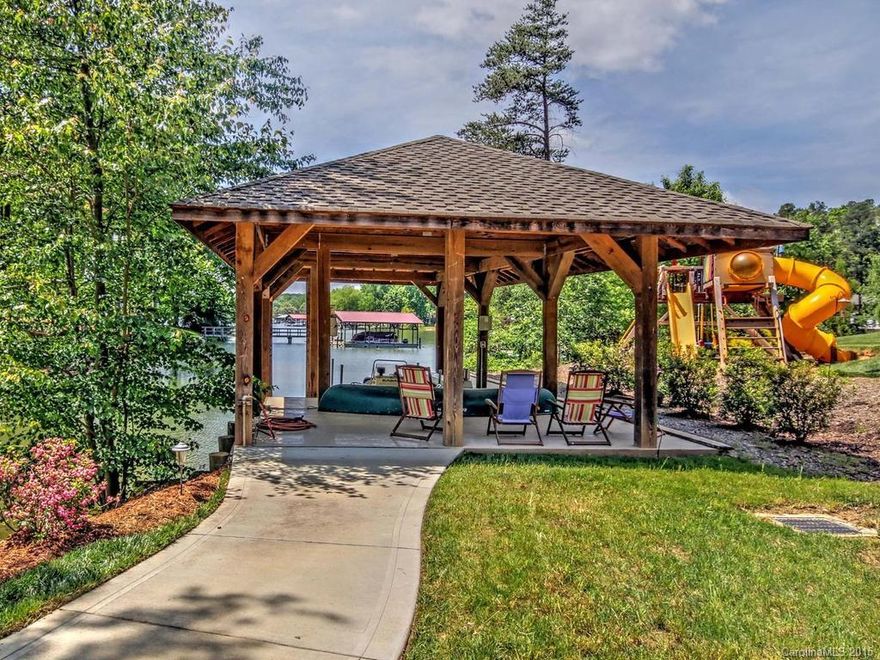 Exquisite Waterfront home for the most discriminating Buyer! Private Gated Entrance. A true Chef's Kitchen with all the features one can dream of. 3600 sq ft climate controlled detached Garage/Shop/full Kitchen/Bath hidden from the house which could serve as a 2nd Living Area. Basement boasts a Kitchen & an upscale Theatre Room with walk-out patio's designed for entertaining.  Beautiful landscaped & wooded estate on nearly 3 arces close to town. Be sure to watch virtual tour. Deep Water!