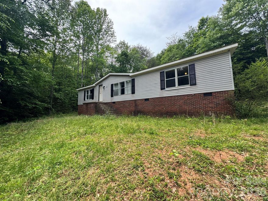 Partially renovated 3 bedroom, 2 bathroom manufactured home offering 1,498 sq ft situated on a total of 4.87 acres across two parcels, including 1.43 acres with the home and an additional 3.44 acres directly behind. Located in the Lincolnton area of Gaston County, the property offers a private, wooded setting with well and septic already in place, providing a strong foundation for future use and improvements.

The home has had renovation work started and is ready for the next owner to complete and bring their vision to life. The layout offers a functional flow with separation between living and bedroom spaces, and existing updates provide a solid starting point for a full remodel. The property is being sold as-is and will require additional work, including replacement of the HVAC system. With two parcels included, this property presents multiple possibilities for investors, flippers, or buyers looking to create a primary residence with acreage and added flexibility. Suitable for cash, conventional, or FHA 203k financing, this is a rare opportunity to secure land, privacy, and potential all in one.