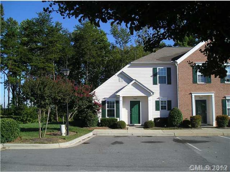 End unit townhome, backing up to woods, with master bedroom on ground floor with easy access to Charlotte, Lake Norman, shopping, restaurants, with the community featuring a pool.