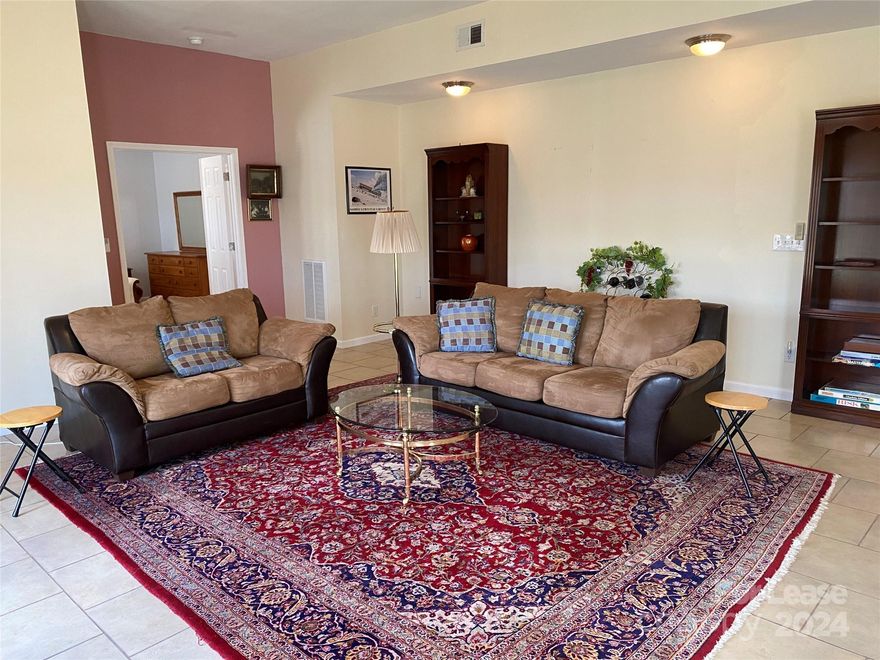 Welcome to this charming 1 bedroom, 1 bathroom waterfront apartment in Mount Holly, NC. This fully furnished apartment boasts a private dock and kayak usage, perfect for enjoying the serene water views. The open floor plan and plenty of windows allow for ample natural light to fill the space. Relax in the heated walk-in shower with both a regular showerhead and rainfall showerhead. Step outside to enjoy two patios - one uncovered and one covered - ideal for outdoor entertaining. With access to community amenities such as a pool, clubhouse, and tennis courts, this home offers the perfect blend of relaxation and recreation. Don't miss out on this peaceful retreat with a private entrance for added convenience. *No Pets Allowed.