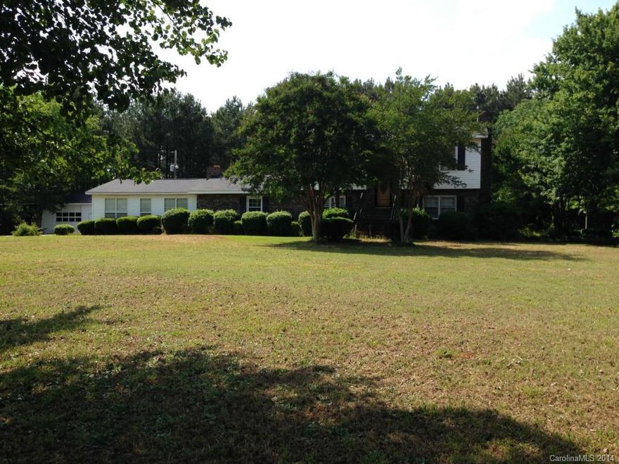 Beautiful custom built home on 5.09 acres. Large rooms including sun room. Den & LR have a fireplace. master Bedroom on main floor. Beautiful hardwood floor. Main house has 3 BR and 2 BA Den & LR. Property has a great detached building with bath & kitchen which could be used as a home office, home school, party or pool house. 1200 SF 2 bay garage workshop. Property does qualify for USDA financing. Priced well below tax value. GREAT DEAL 
BACK ON THE MARKET AND REDUCED