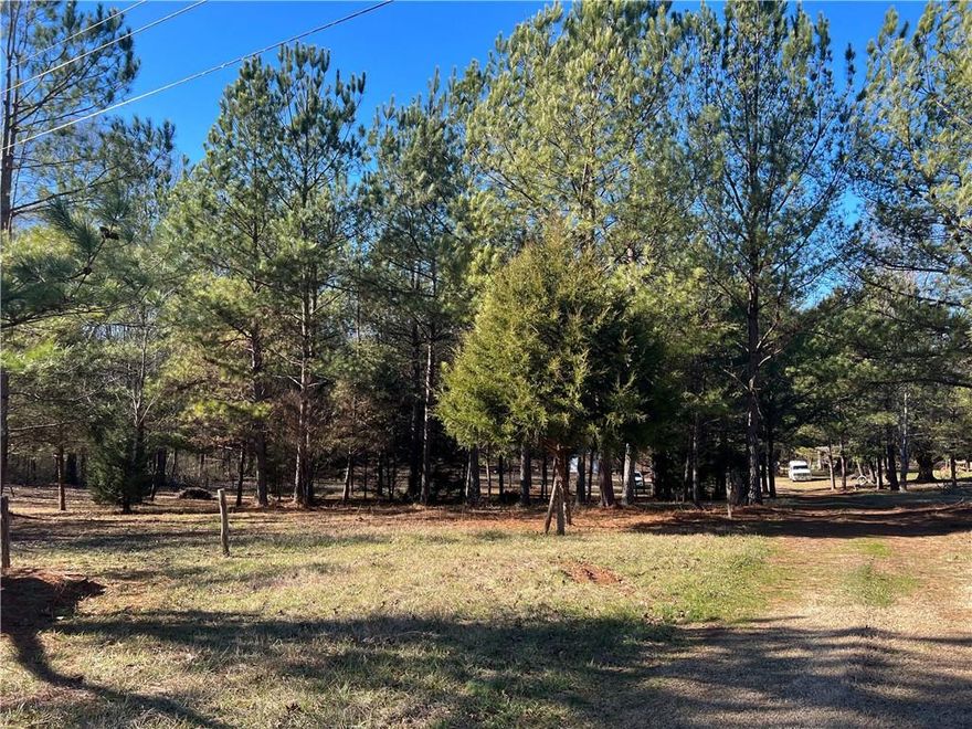 Beautiful 20.66 acre parcel, includes well, septic, and electric.  With over 461 feet of street frontage on US Hwy 64, this property offers so many different options.  Lots of wild life on property and would be well suited for hunting, recreation, or build an estate home with plenty of additional land for recreation.  The property does include two spring fed year round streams as well as multiple trails and clearings cut through out the property.  A large barn stands in close proximity to the main entrance as well as a small fenced in pasture, ideal for smaller farm animals.