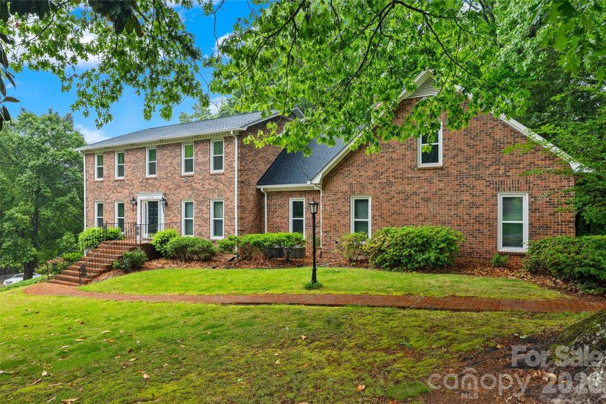 Set on a sprawling 0.84-acre corner lot in a quiet Shiland Hills cul-de-sac, this all-brick estate offers character and modern functionality. The attention to detail is evident before you even step inside, with a classic brick driveway and a side-load garage featuring brick flooring. The heart of the home is the kitchen, where warm brick floors meet granite counters and stainless steel appliances, all overlooking a wooded backyard with a gazebo and a brick patio. The layout is designed for flexibility, offering a bedroom and full bath on the main level, along with a primary suite that includes a private attached office or nursery. Upstairs, a massive bonus room provides additional space for any hobby. The finished basement is a standout feature, serving as secondary living quarters with its own kitchen, recreation room, and a large bar area for entertaining. With a brand-new roof installed in 2024 and close proximity to local shopping and dining, this home is as practical as it is charming.
