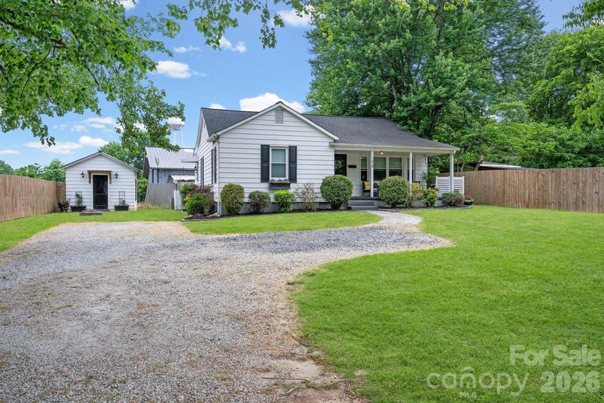 Charming home in a convenient downtown location offering comfort, character, and functional living space. Inside you will find wood, vinyl, and carpet flooring, spacious bedrooms, and a custom walk-in closet with excellent storage. The eat in kitchen features built in banquet seating that creates the perfect space for meals, gatherings, or morning coffee. A spacious laundry room adds extra convenience and flexibility. Outside, enjoy a flat lot with mature shade trees, privacy fence, and expansive front porch ideal for relaxing evenings. Conveniently located near shopping, dining, and local amenities, this property offers a great combination of charm and accessibility.