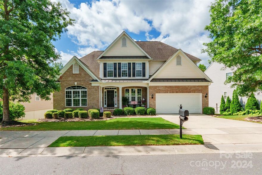 Step into elegance with this breathtaking home, where every detail exudes charm. Adorned with beautiful curb appeal and a welcoming front covered sitting porch, this residence offers a warm invitation from the moment you arrive. Inside, the main level features a dining room with tray ceilings & an adjacent room ideally suited as a home office. The heart of the home, the kitchen, boasts a pantry, kitchen island, granite countertops, and SS appliances, seamlessly flowing into the living room with a cozy fireplace. A luxurious primary suite on the main level awaits, featuring tray ceilings, a walk-in closet, and an ensuite BR with a dual vanity & garden tub. Upstairs, discover the remaining bedrooms & a bonus room. The full basement, currently unfinished, presents boundless opportunities for customization into additional living space. Outside, an upper-level deck overlooks the vast backyard. Nestled within a vibrant community, amenities abound with a pool, playground, clubhouse, and more!