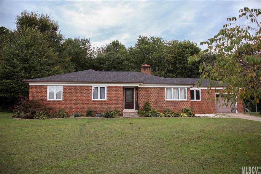 Ready to move in 3 bedroom, 1-1/2 bath brick ranch in convenient NE Hickory. Hardwood floors in living room, den and bedrooms. 50 year, waterproof luxury vinyl tile in the kitchen/dining area and 1/2 bath. Full bath has been updated with tile surround and floor. Kitchen offers new stainless appliances including dishwasher, gas range and hood. Electrical plug is in place if you prefer electric range. New counter tops and tile backsplash. Other features include built-ins and wood burning fireplace. Partially fenced back yard with large outbuilding. Property extends beyond the fence into the wooded area.