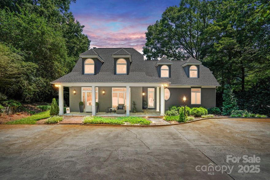 Beautiful home and amazing view! Step inside this immaculately designed and maintained home to an open, spacious floorplan designed to maximize natural light and showcase outstanding views. The main floor boasts dining, 20 ft vaulted great room with gas logs, open kitchen and breakfast area with hardwood throughout. The large primary suite stuns with built in cabinetry, walk-in closet, a large garden tub and tiled shower. Upstairs are 2 bedrooms, a Jack and Jill bathroom and a home office or bonus space. New luxury vinyl tile is found throughout the upstairs, with new carpet on the stairs. Most every room in the home displays views of the water. Expansive decks and stone fire pit are ready for entertaining. Situated on .85 acres with a private dock, boat lift, 150 ft of deep water shoreline year round, boat house and ramp with storage for all your watercraft! Tons of outdoor storage under decks and an expansive walk in basement and crawl space area. Do not let this beauty pass you by!