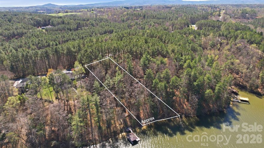 Embrace the opportunity to own a beautiful 0.963 acres of waterfront property with stunning lake views and 173 ft shoreline, perfect for your second home, weekend retreat, or even a primary residence. This versatile homesite offers the ideal setting for peaceful lake living, whether you’re seeking relaxation, adventure, or year-round enjoyment.
Residents of Harbor Ridge enjoy a welcoming community with amenities that include:
•  A picnic area ideal for gatherings
•  RV and boat storage available to homeowners
•  A community boat dock providing convenient access to Lake Rhodhiss
Opportunities like this don’t come along often—don’t let this one pass you by.
Harbor Ridge is one of the area’s most established lakefront communities, located just three miles from I-40 for effortless travel. Explore Asheville and the Blue Ridge Mountains within an hour, head east toward Hickory, or enjoy easy access to Charlotte Douglas International Airport in under 1.5 hours. From the community entrance, you can also travel north to Blowing Rock and Boone for year-round mountain adventures.