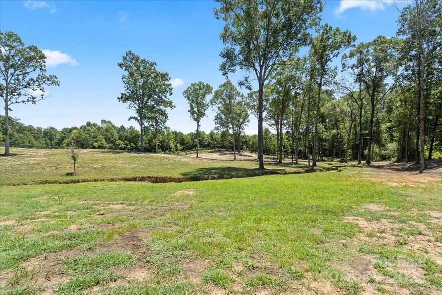 LAND CAN BE SUBDIVIDED - PER COUNTY- Located at the end of a quiet cul-de-sac, this private 4-acre lot offers the perfect setting to build your dream home. Surrounded by nature and offering a peaceful retreat, the property provides ample space and flexibility for a custom residence, outdoor living, and more. Enjoy the privacy of a wooded backdrop with minimal traffic and the serenity of a secluded location just minutes from town conveniences.

Please note: an engineered drip dispersal septic system is required - THIS REPORT WAS DONE A WHILE BACK. No double wides allowed but MODULAR HOMES ARE ALLOWED -BUYER AGENT TO VERIFY ALL INFORMATION WITH COUNTY.