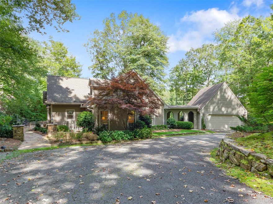 Welcome to this updated golf course cottage with an up the fairway view. The gentle sloping lot gives you the perfect amount of lush green lawn complete with a waterfall and pond water feature. From the front patio area into the front door, you are welcomed into a front entry with built in bookshelves and an extra wide staircase to the guest bedrooms and bathrooms. Walk through the entry into the dining area that is open to the living room with a stone wood burning fireplace including an effortless gas starter. The laundry room in conveniently located off the kitchen with stackable units and a snug powder bath. A sitting room by the kitchen with an entry door from the breezeway will be the perfect place for your morning coffee or evening cocktail. The master bedroom is warm space with bright walls and ceilings that lead into a huge walk-in closet.  The pegged post and beam construction make for a charming golf cottage feel. It will be hard to ever leave your house!